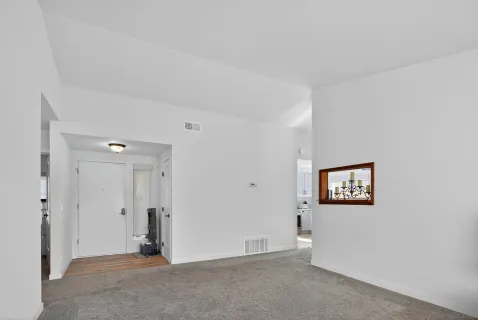 a view of an empty room with a bathroom
