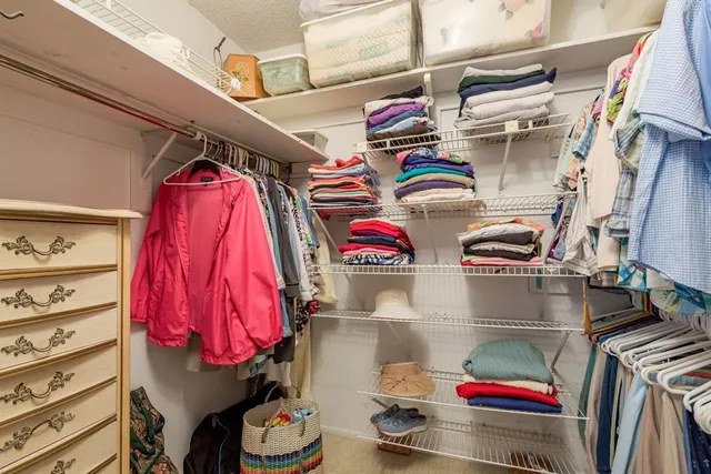 a bathroom with a sink mirror vanity and toilet