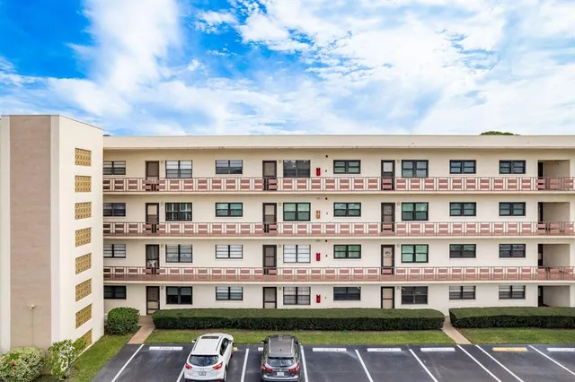 a front view of a building with lot of windows