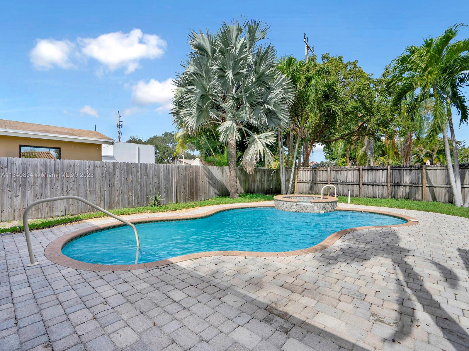 4007 West Park Road Hollywood, FL 33021 - Photo 24 of 31 a view of a backyard with swimming pool and seating space