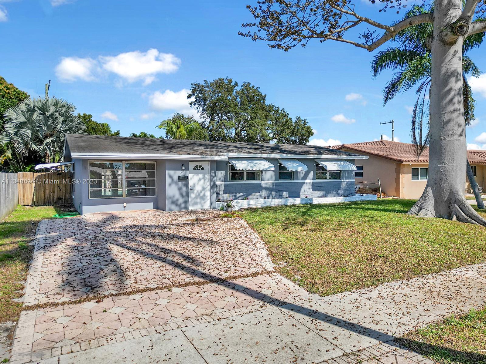 4007 West Park Road Hollywood, FL 33021 - Photo 3 of 31 front view of a house with a yard