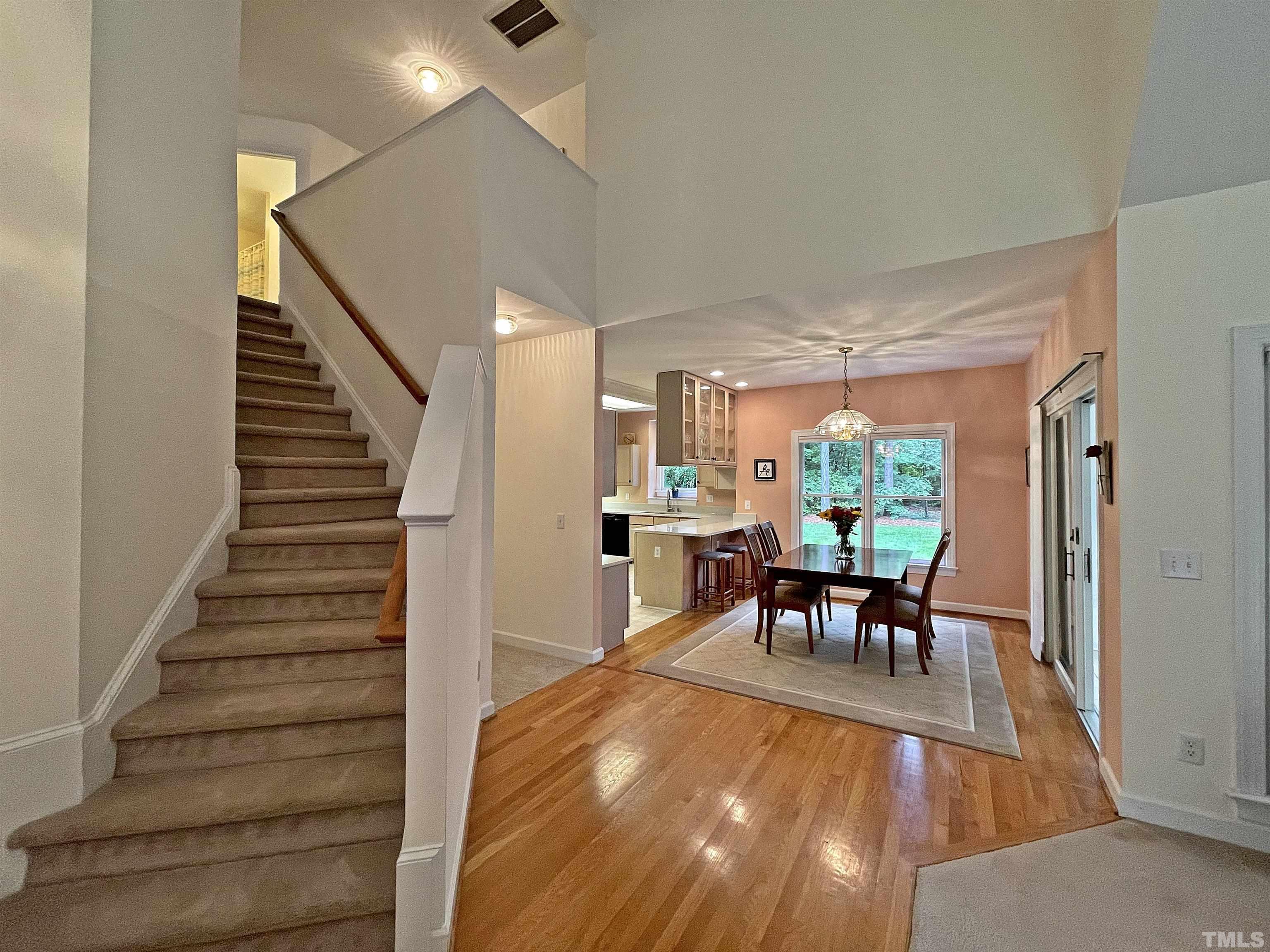 5437 Denberg Lane Raleigh, NC 27606 - Photo 13 of 45 a dining room with furniture and wooden floor