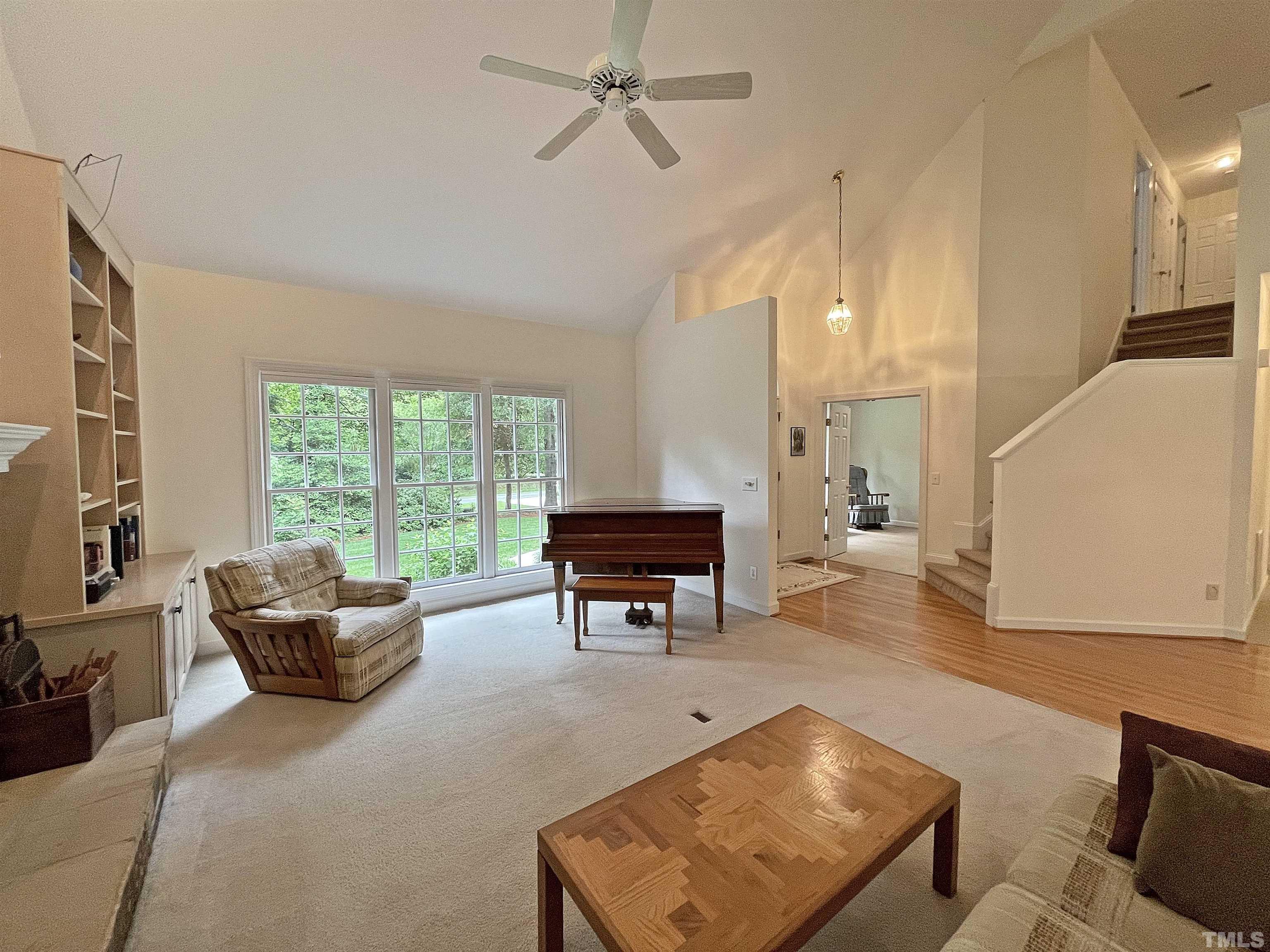 5437 Denberg Lane Raleigh, NC 27606 - Photo 15 of 45 a living room with furniture and a large window