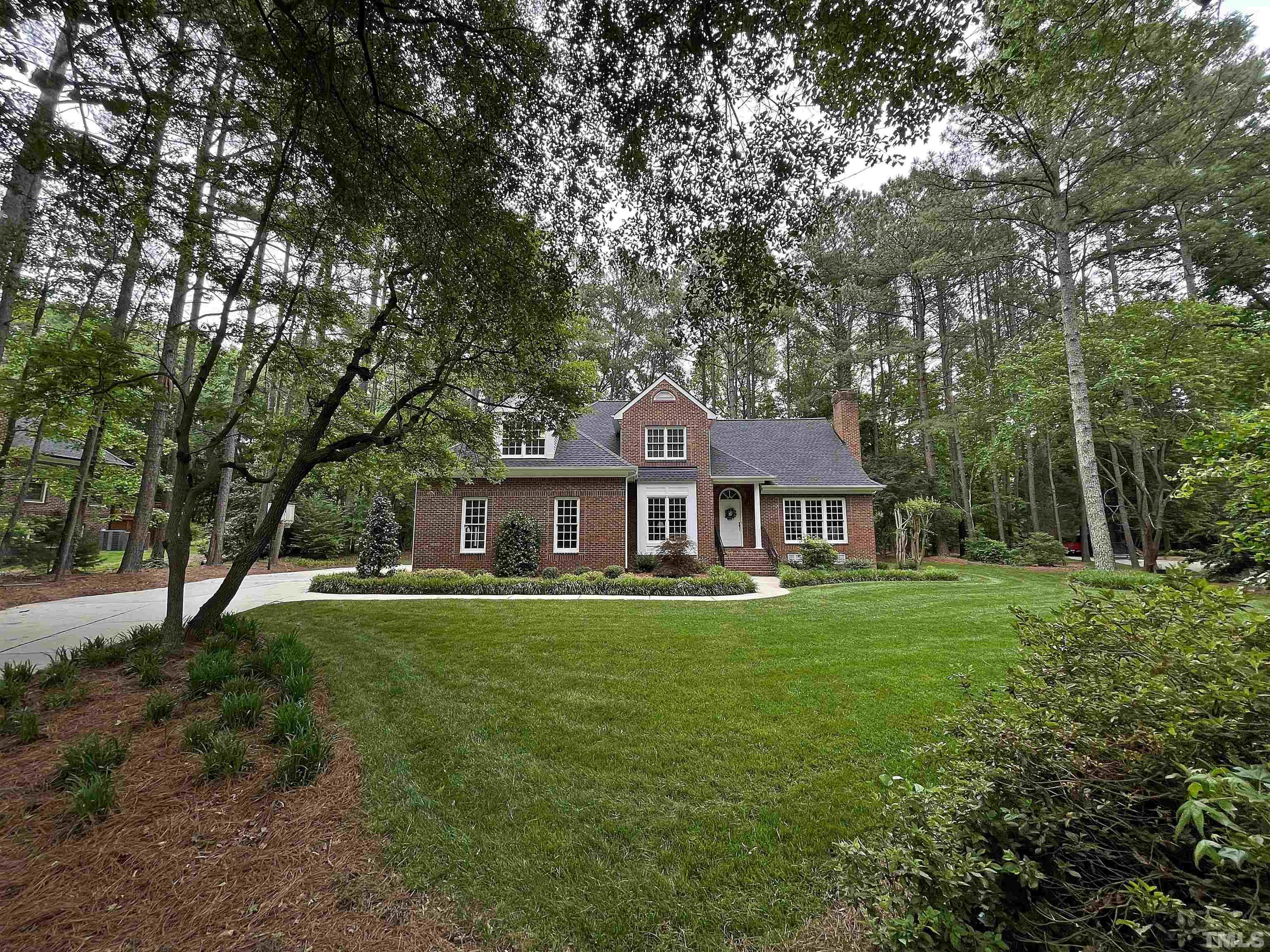 5437 Denberg Lane Raleigh, NC 27606 - Photo 3 of 45 a front view of a house with a garden