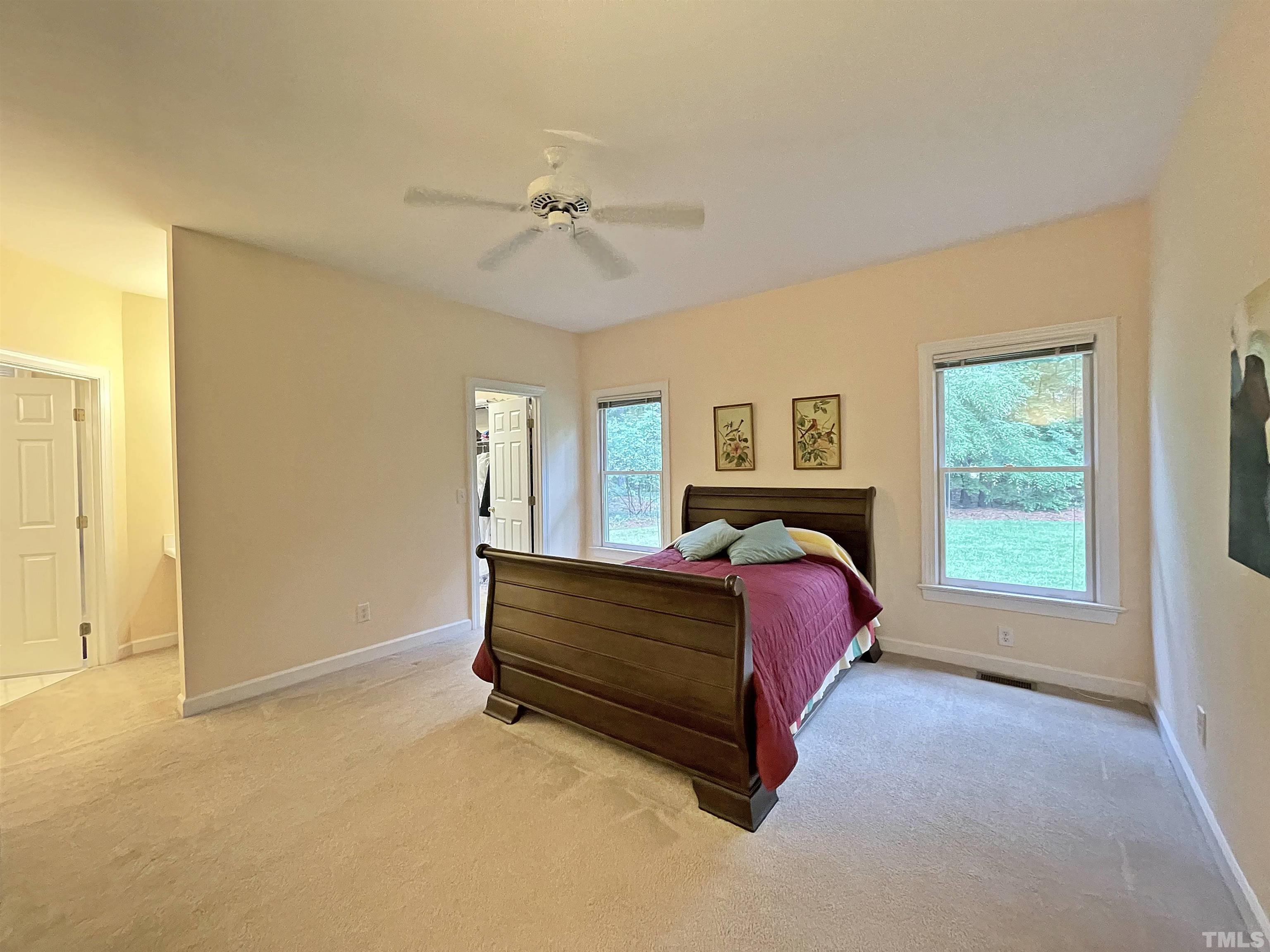 5437 Denberg Lane Raleigh, NC 27606 - Photo 31 of 45 a bed sitting in a spacious bedroom next to a window