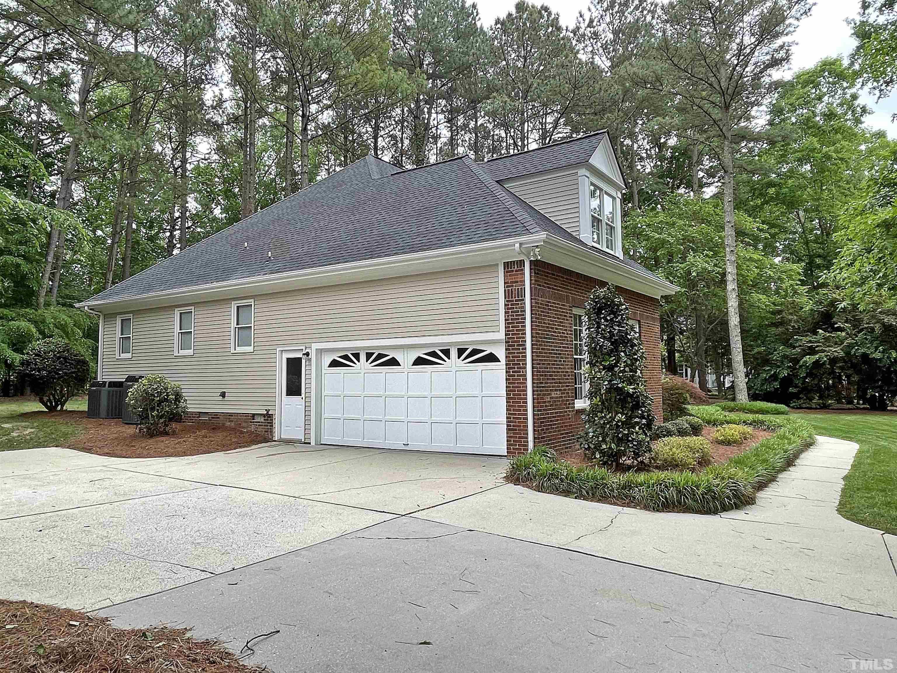 5437 Denberg Lane Raleigh, NC 27606 - Photo 6 of 45 a view of a house with a outdoor space and a tree