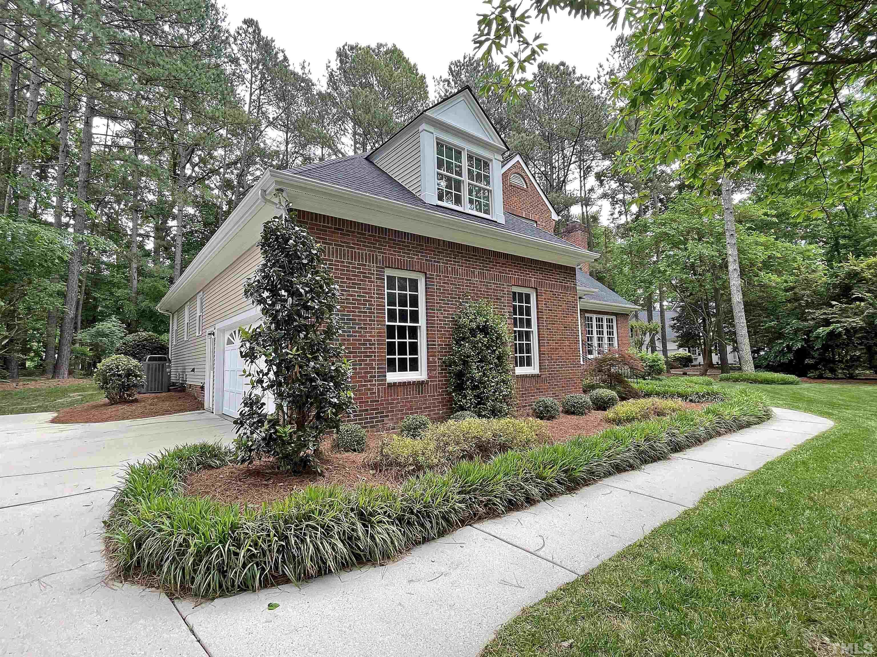 5437 Denberg Lane Raleigh, NC 27606 - Photo 8 of 45 a front view of a house with garden