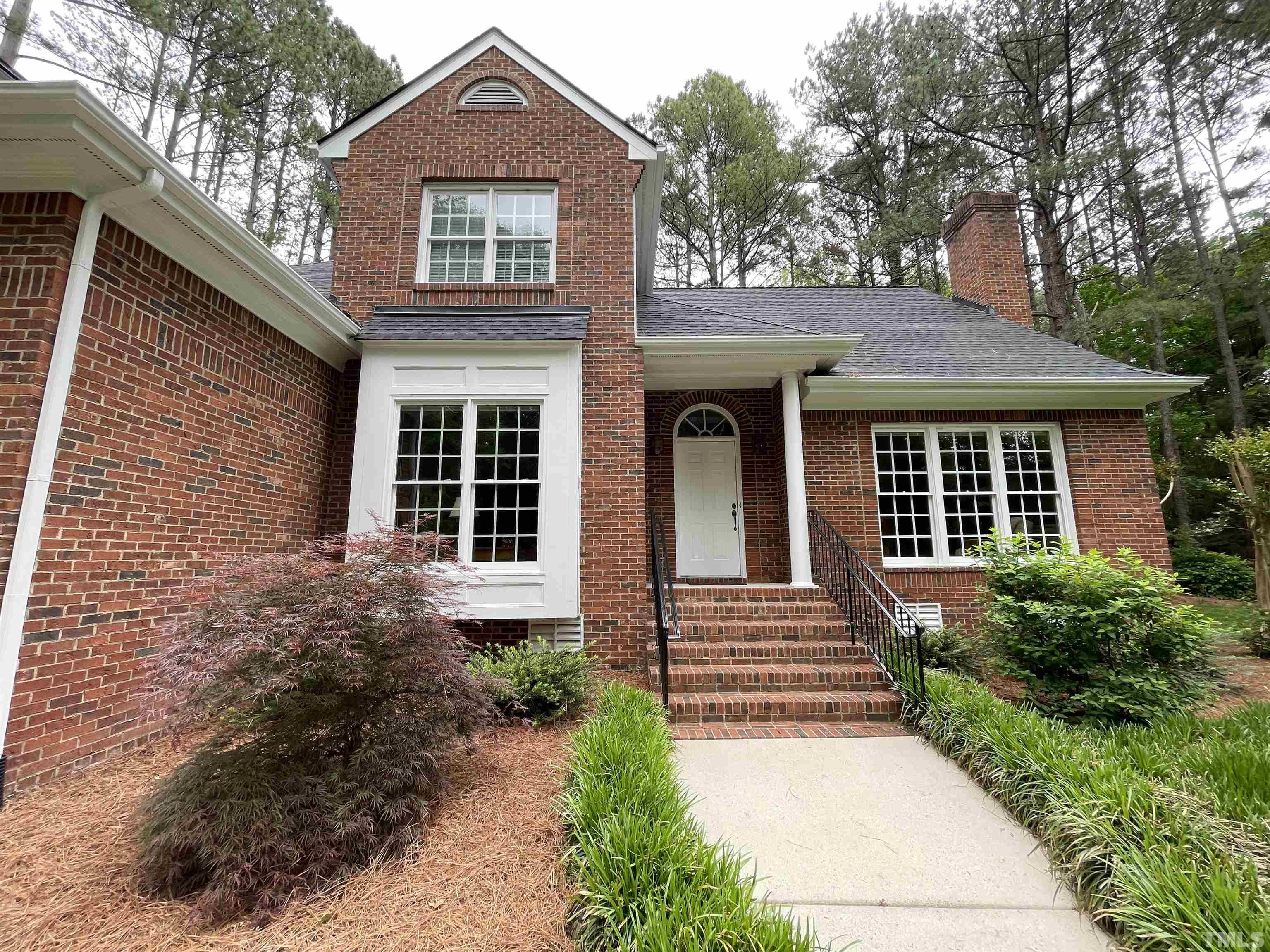 5437 Denberg Lane Raleigh, NC 27606 - Photo 10 of 45 a front view of a house with garden