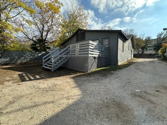 a view of a terrace with wooden wall