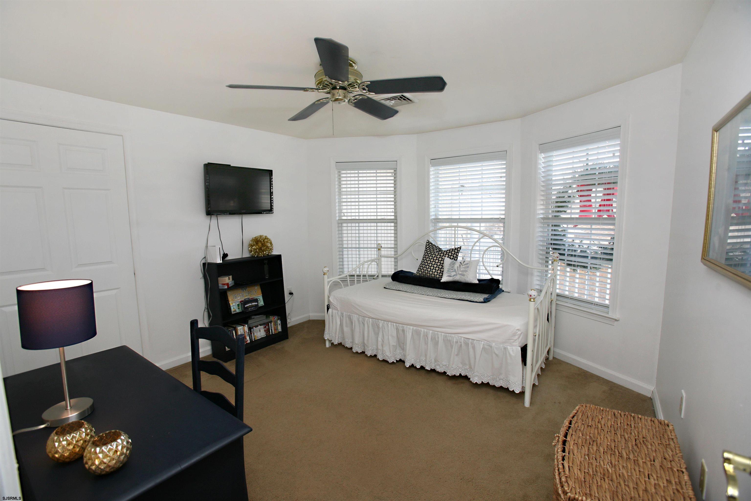 556 Grape Street Hammonton, NJ 08037 - Photo 18 of 26 a bedroom with a bed and a television