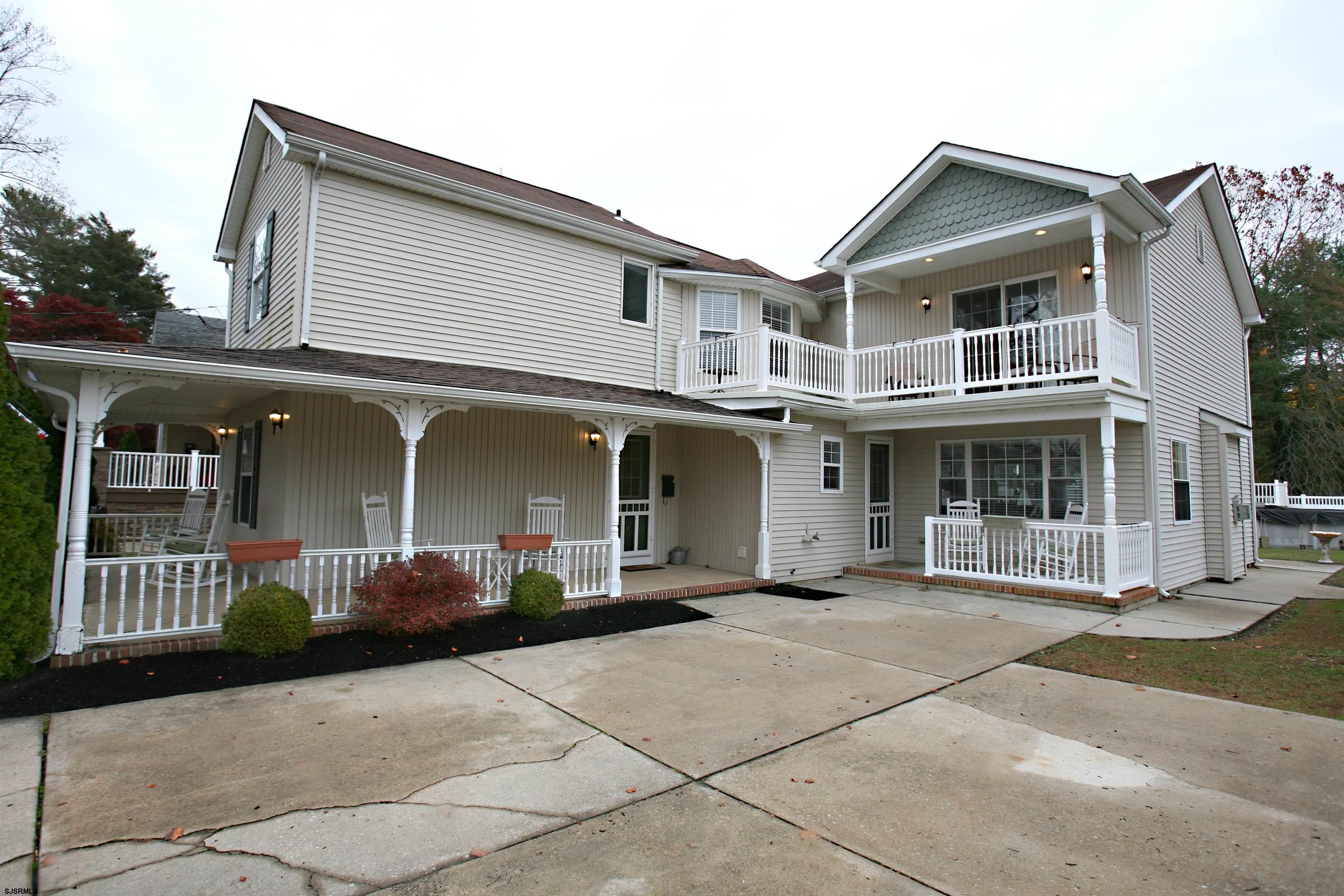 556 Grape Street Hammonton, NJ 08037 - Photo 2 of 26 a front view of a house with a garden