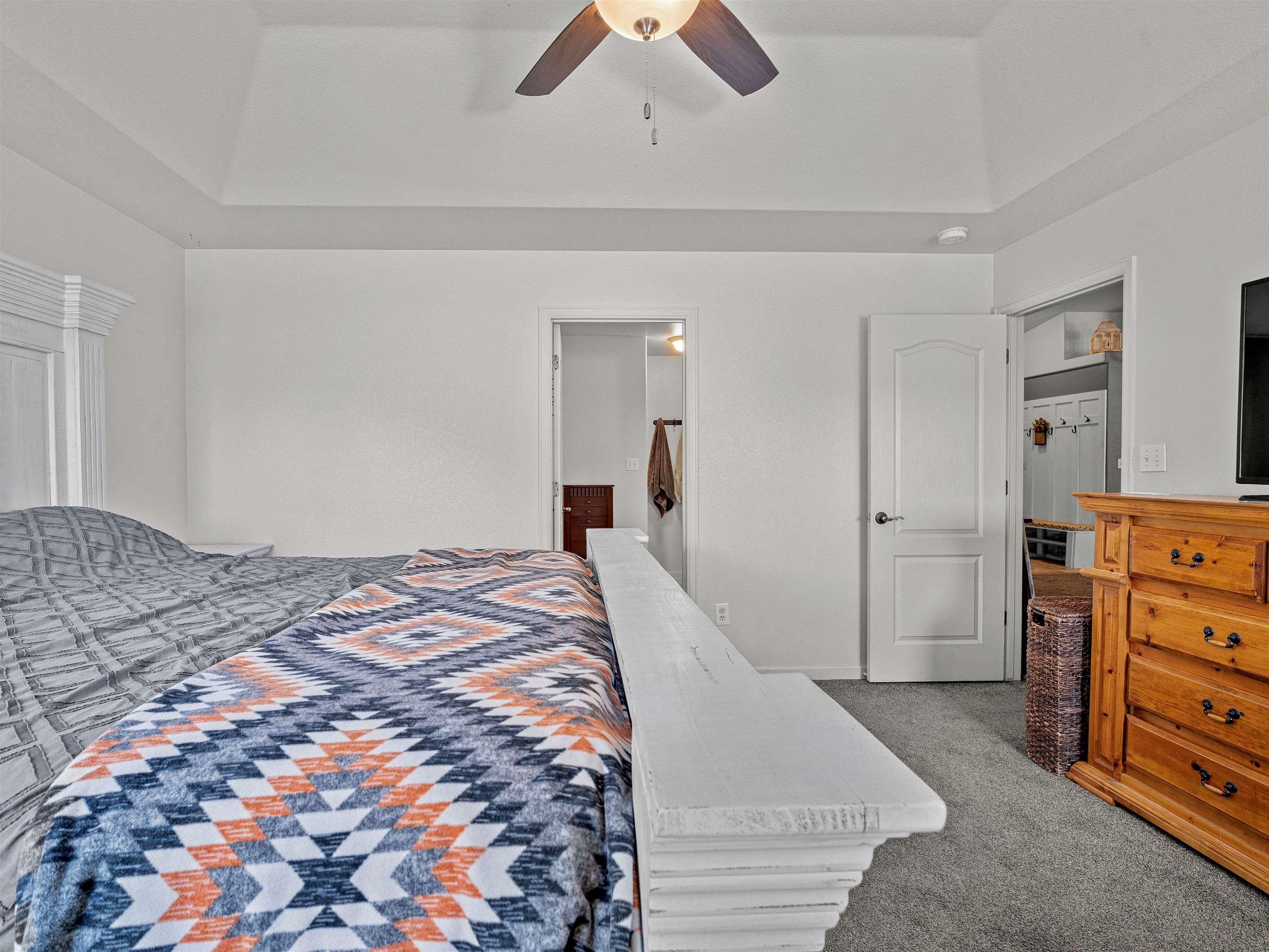 680 Stone Mountain Drive Fruita, CO 81521 - Photo 18 of 32 a bedroom with a bed and a dresser