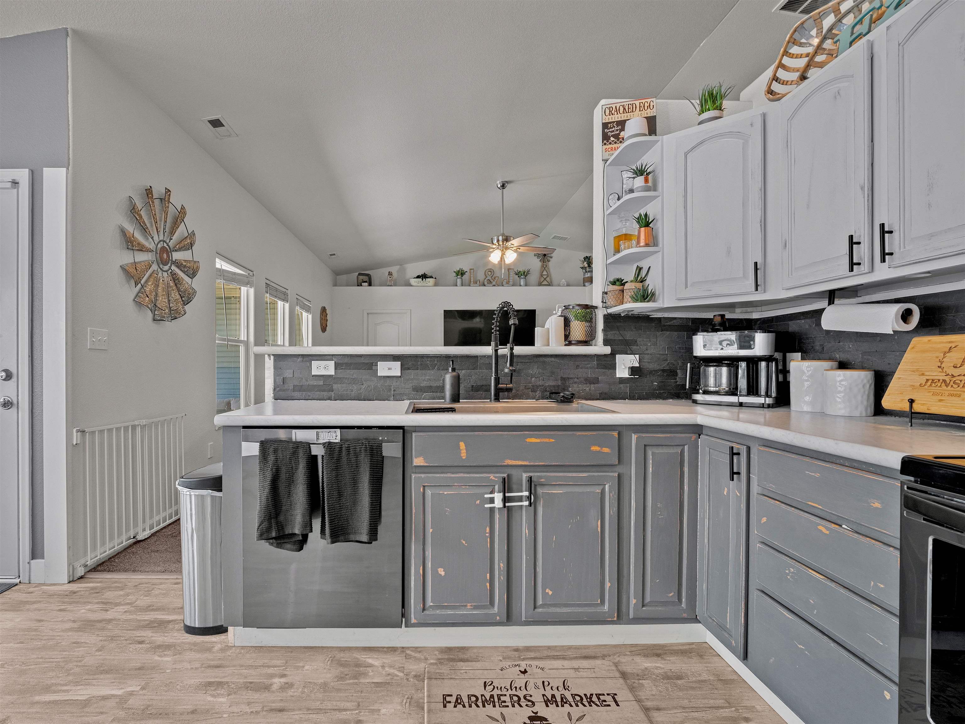 680 Stone Mountain Drive Fruita, CO 81521 - Photo 22 of 32 a kitchen with stainless steel appliances granite countertop a sink and cabinets