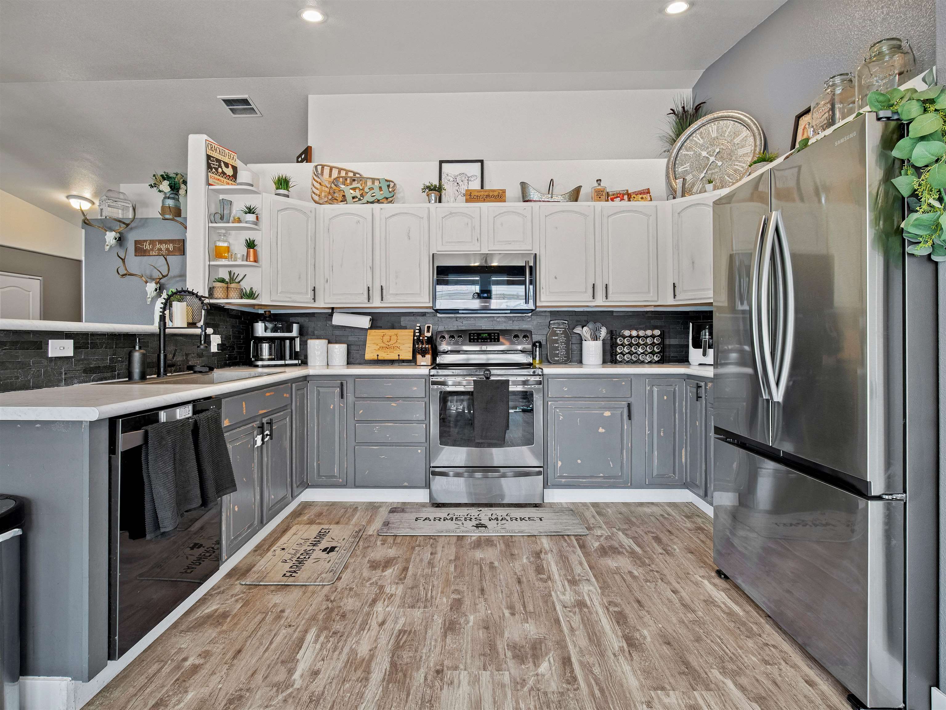 680 Stone Mountain Drive Fruita, CO 81521 - Photo 23 of 32 a kitchen with stainless steel appliances granite countertop a refrigerator and a stove top oven