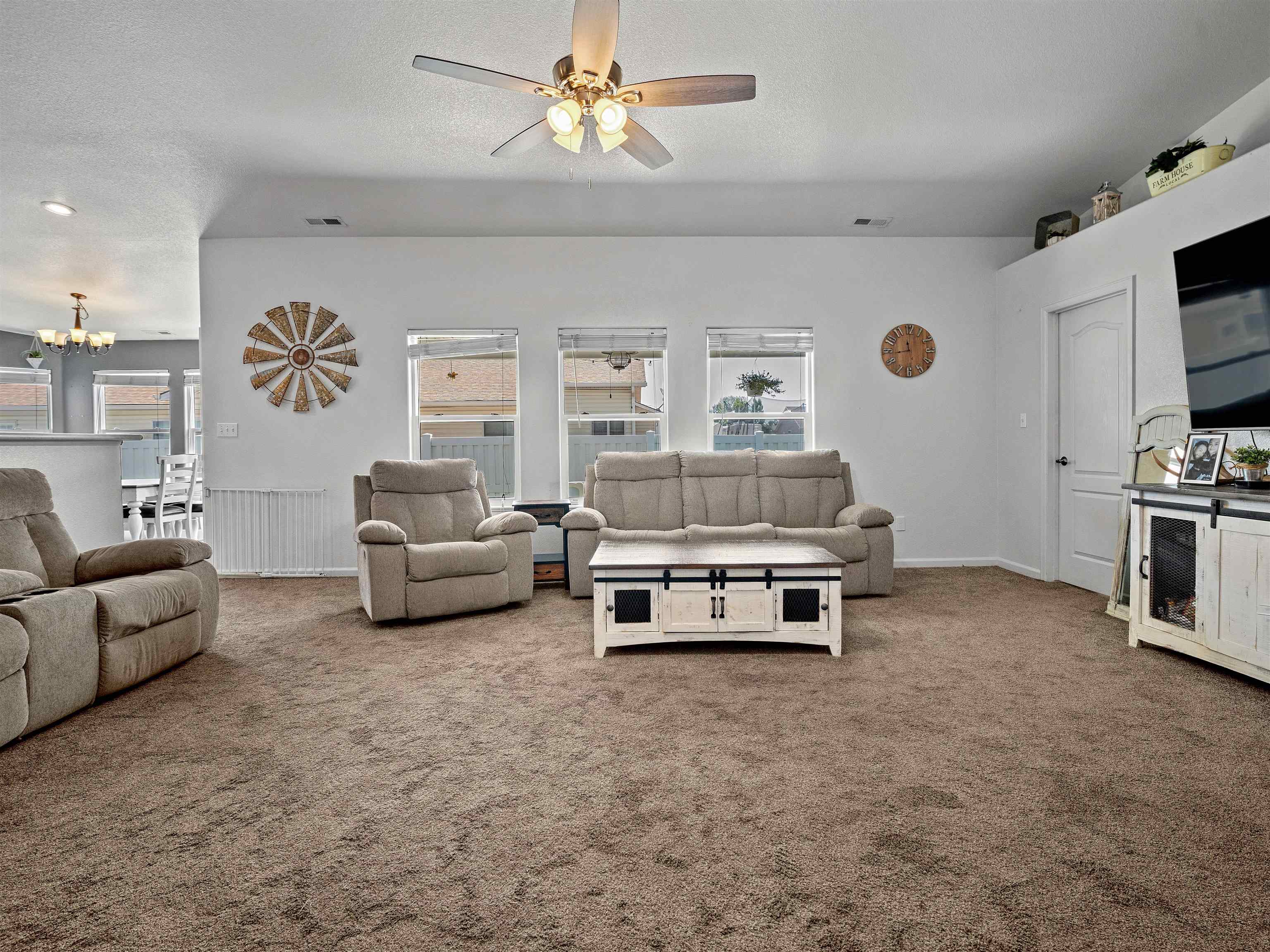 680 Stone Mountain Drive Fruita, CO 81521 - Photo 26 of 32 a living room with furniture and a flat screen tv