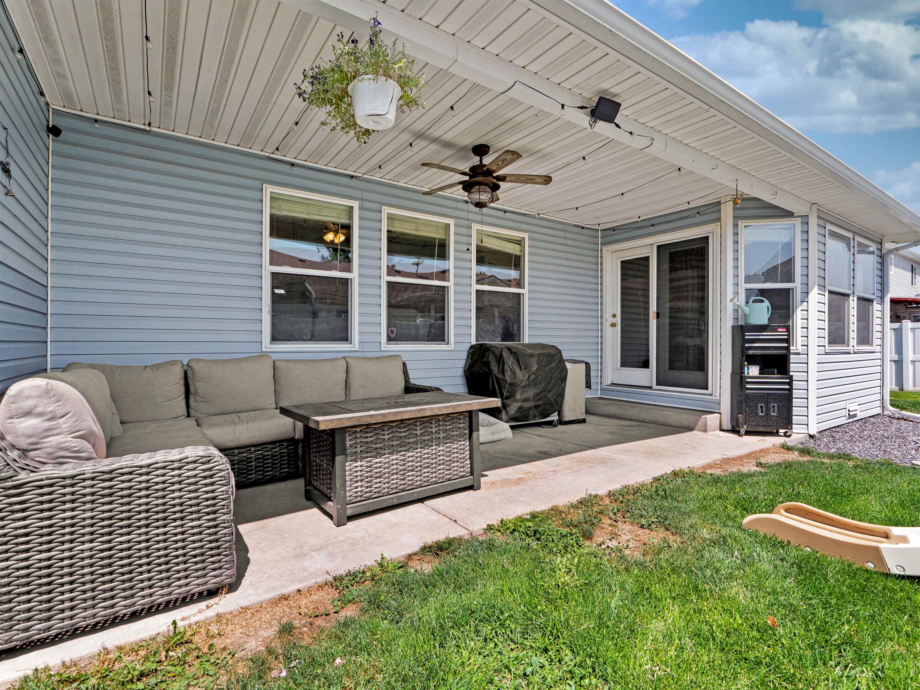 680 Stone Mountain Drive Fruita, CO 81521 - Photo 7 of 32 a view of a patio with couches chairs and potted plants