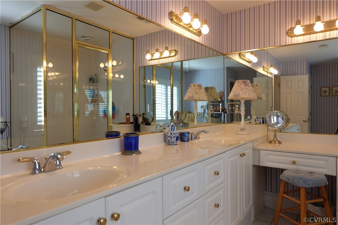 11903 Reeds Bluff Lane Midlothian, VA 23113 - Photo 16 of 24 a bathroom with a sink and a mirror