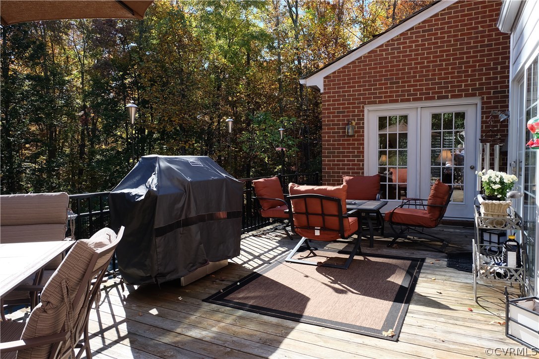 11903 Reeds Bluff Lane Midlothian, VA 23113 - Photo 22 of 24 a view of a dinning tables and chairs in the roof deck