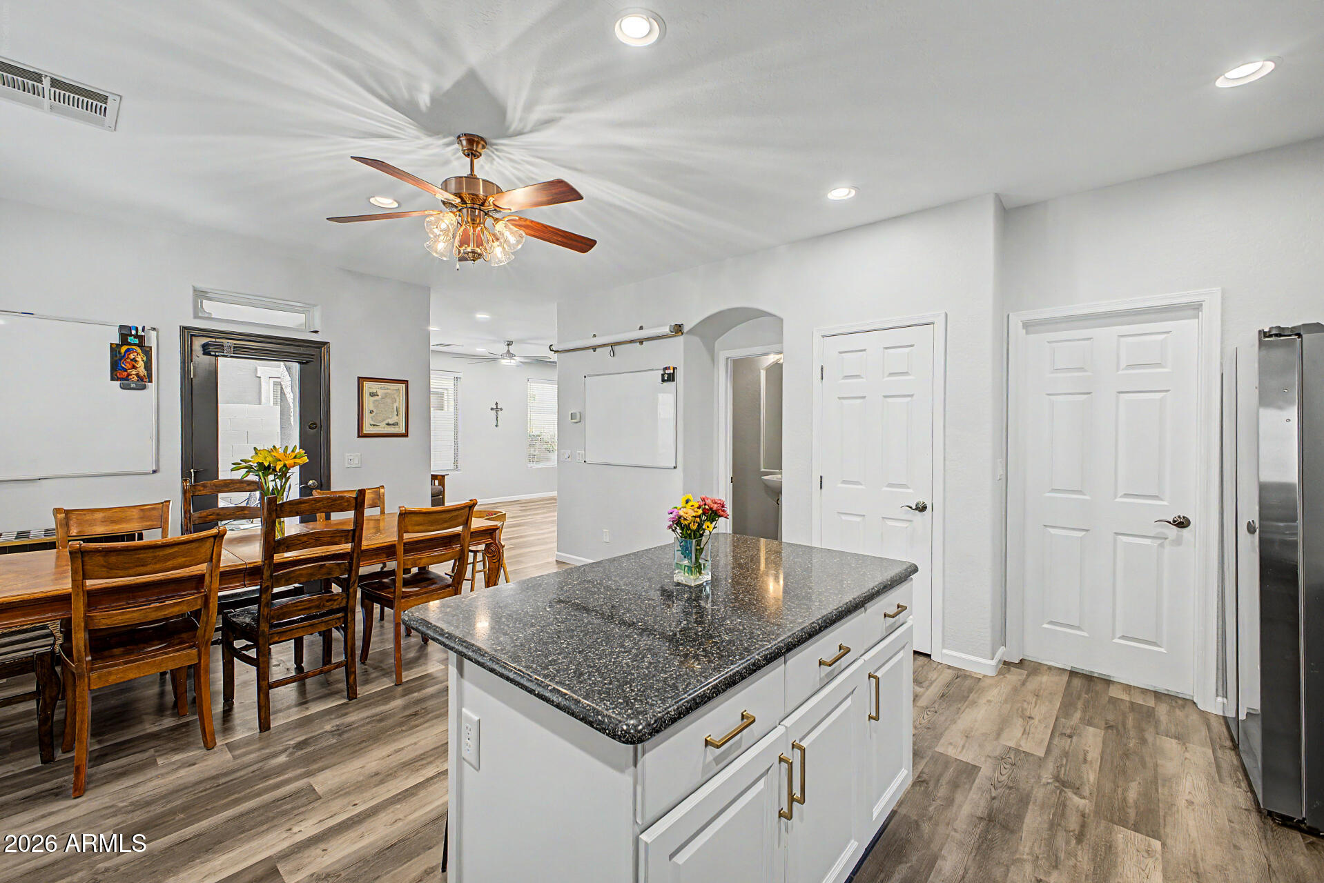 4331 East Cullumber Street Gilbert, AZ 85234 - Photo 13 of 42 a kitchen with stainless steel appliances granite countertop a stove and a refrigerator