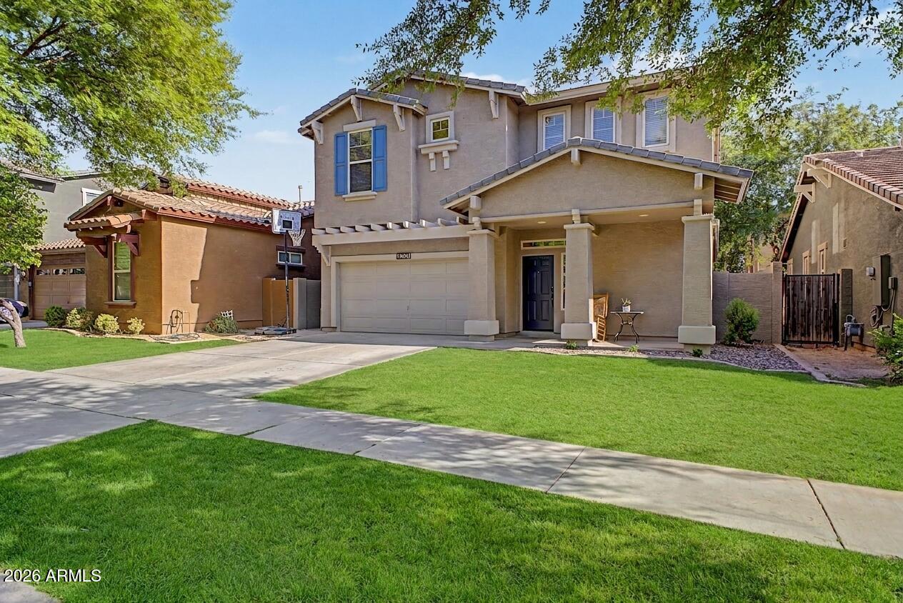 4331 East Cullumber Street Gilbert, AZ 85234 - Photo 2 of 42 a view of a house with a yard plants and large tree