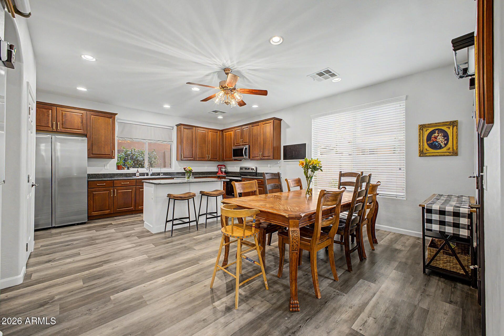 4331 East Cullumber Street Gilbert, AZ 85234 - Photo 8 of 42 a view of a dining room with furniture and wooden floor