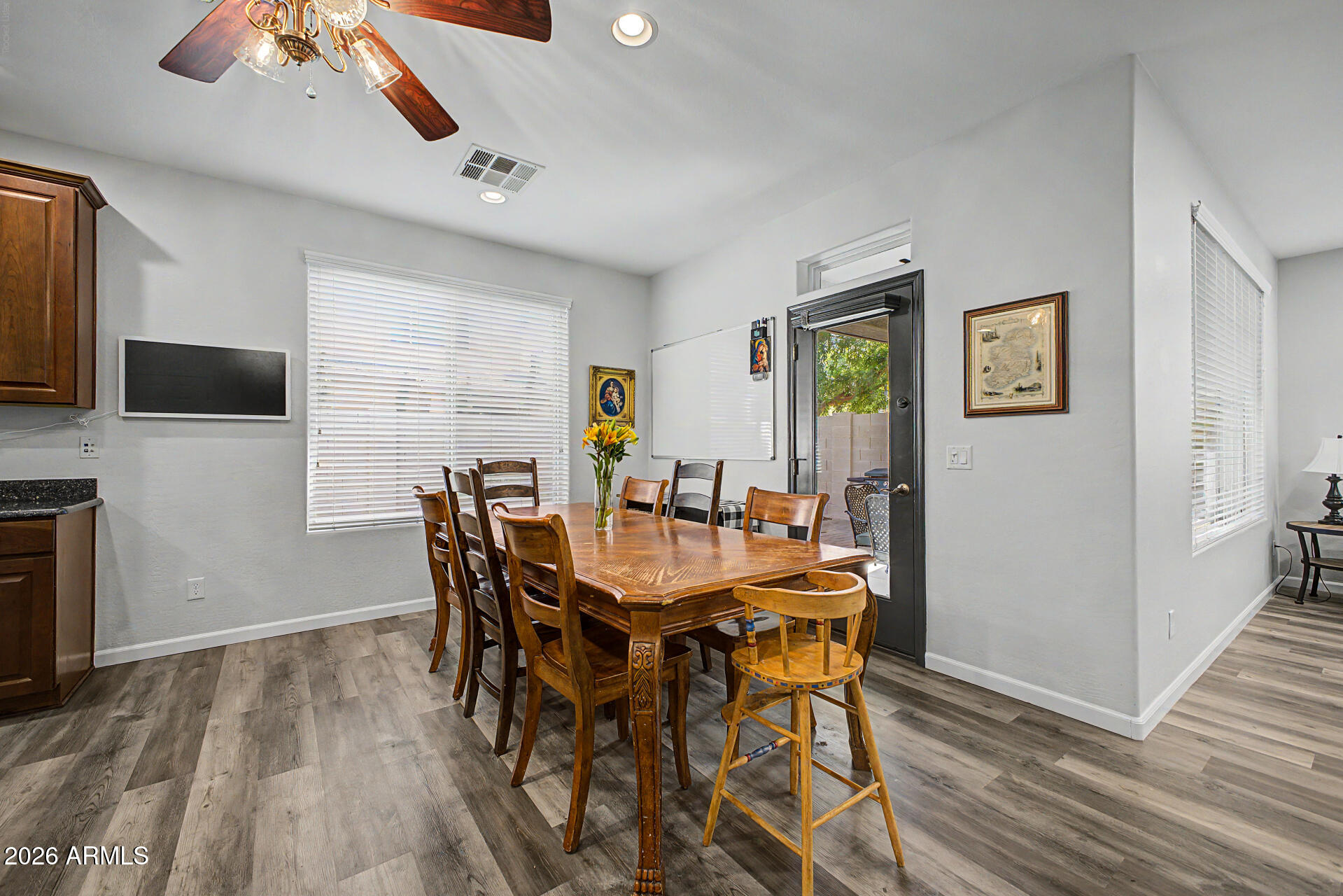 4331 East Cullumber Street Gilbert, AZ 85234 - Photo 9 of 42 a view of a dining room with furniture and wooden floor