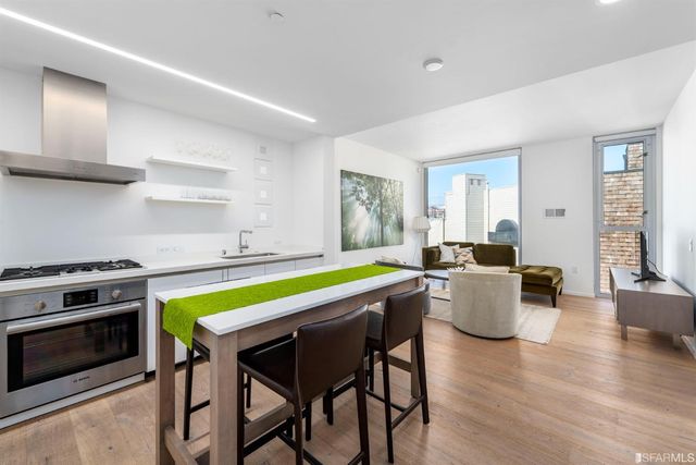 a kitchen with a table and chairs in it