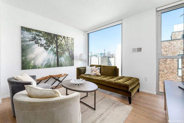 a bedroom with a large bed and a large window