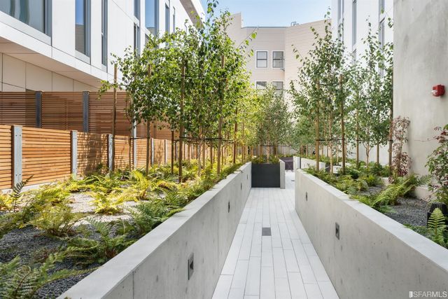 a view of a living room and kitchen
