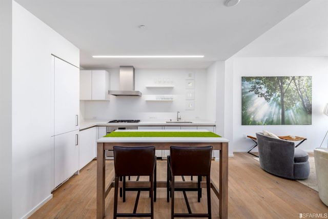 a stove top oven sitting inside of a kitchen