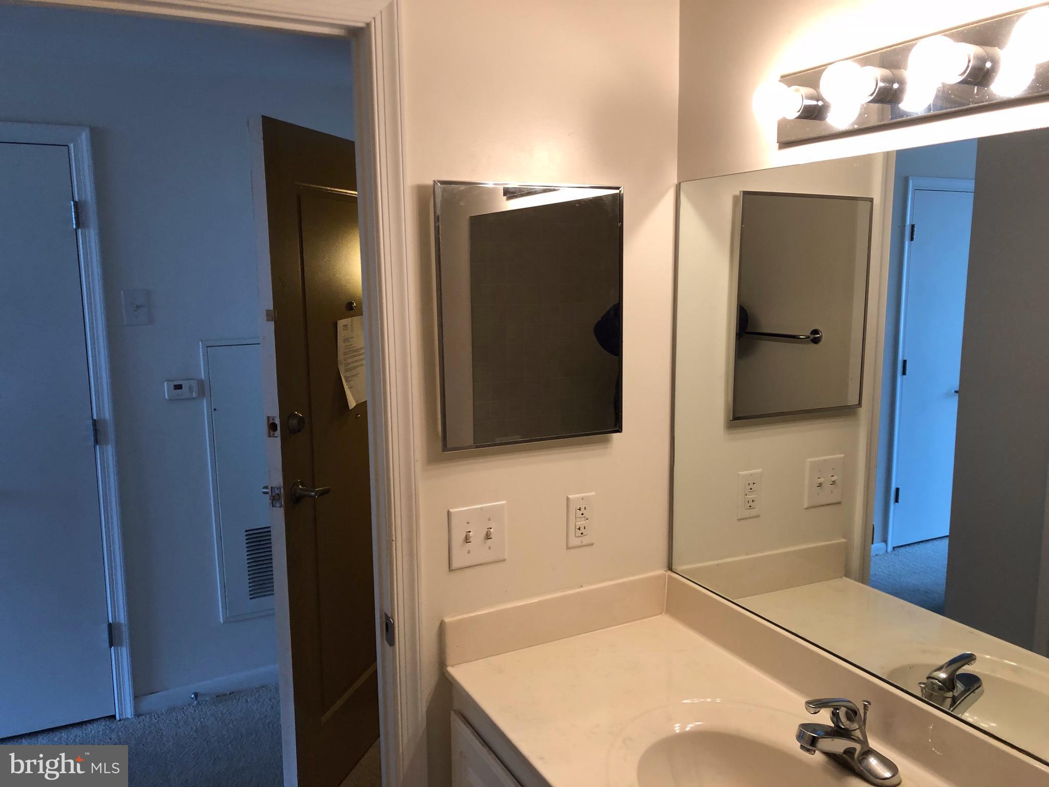 355 I Street Southwest, Unit 626 Washington, DC 20024 - Photo 4 of 8 a bathroom with a tub and a shower