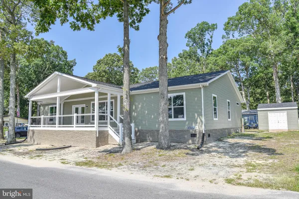 a house with trees in the background