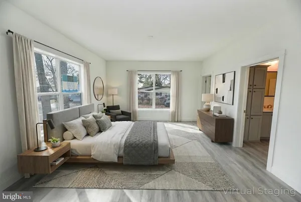 a spacious bedroom with a large bed and a couch