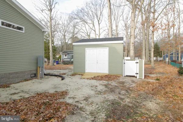 a view of a house with a yard and garage