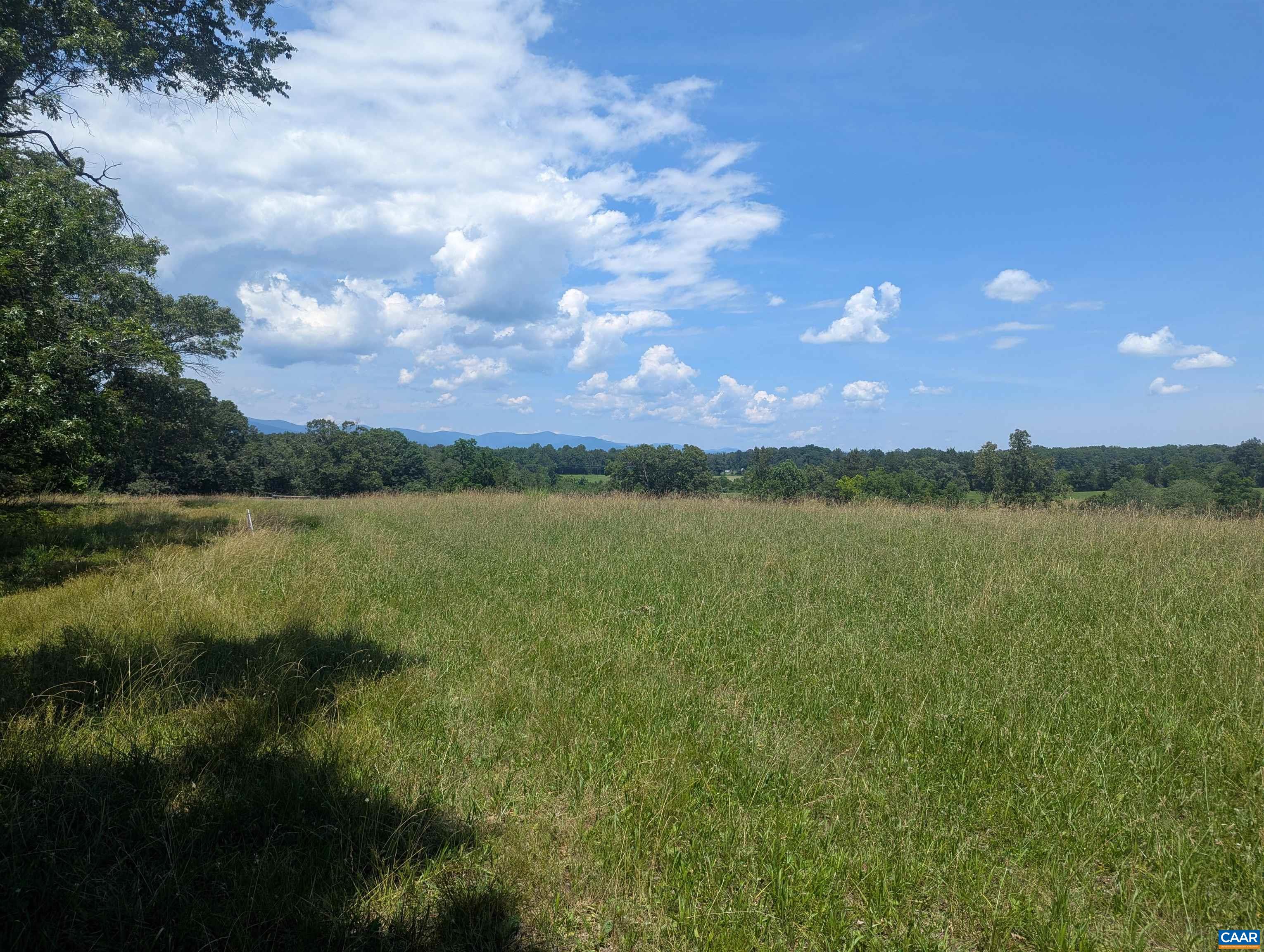Lot 7 Advance Mills Road Ruckersville, VA 22968 - Photo 15 of 26 a view of a lake from a yard