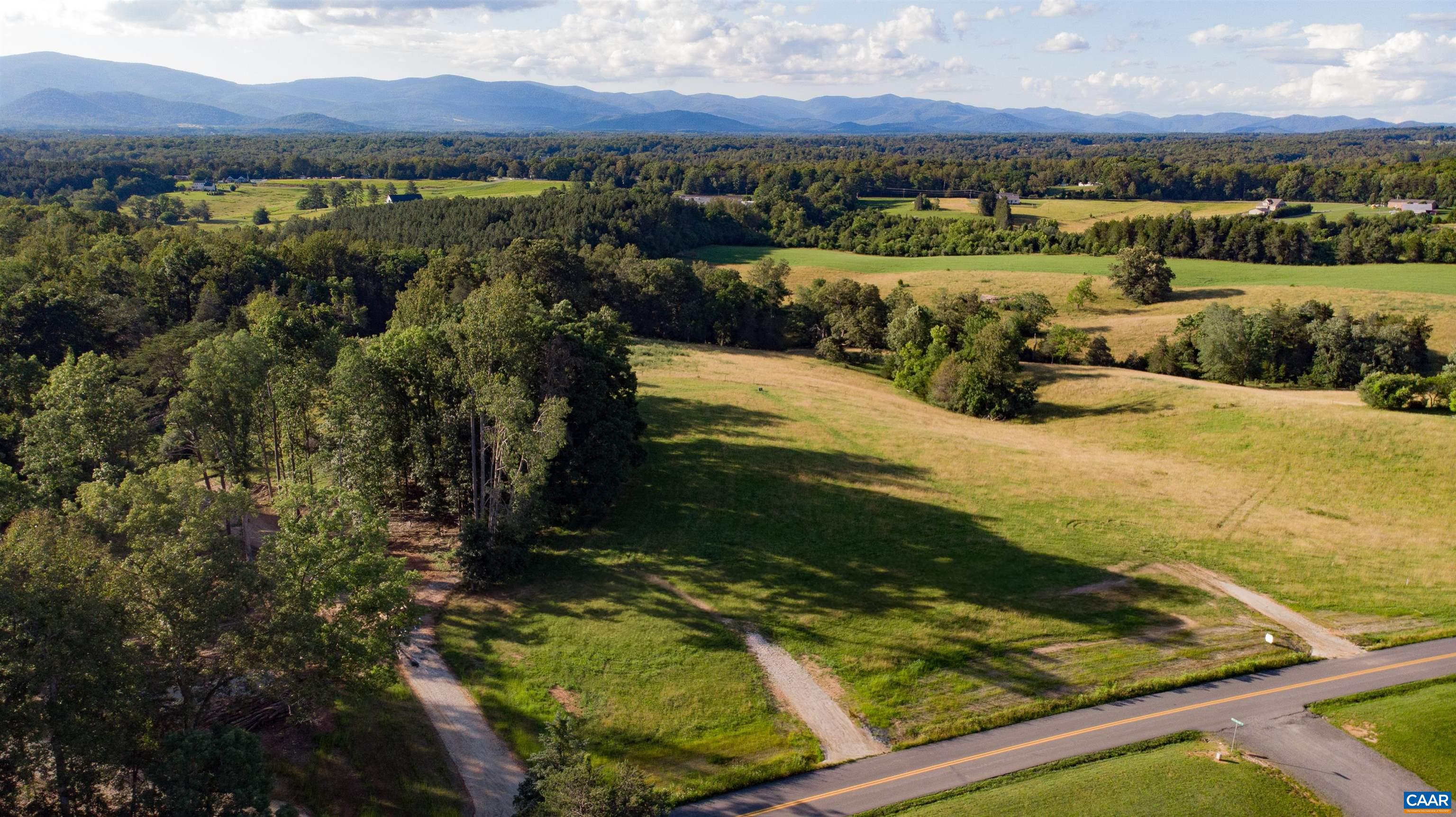 Lot 7 Advance Mills Road Ruckersville, VA 22968 - Photo 16 of 26 a view of a city with mountains in the background