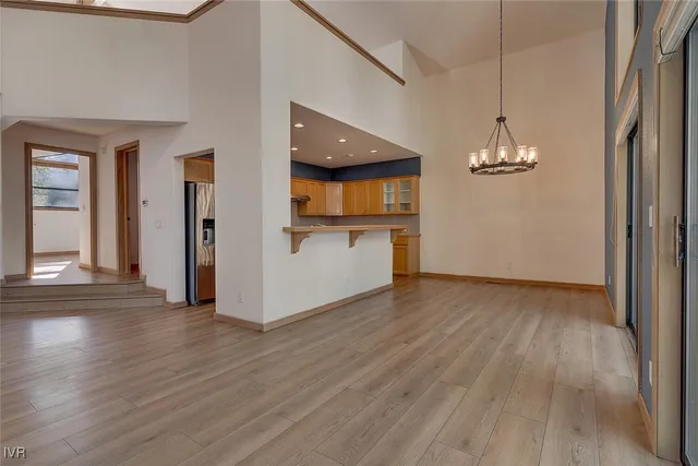 a view of a room with wooden floor and stairs