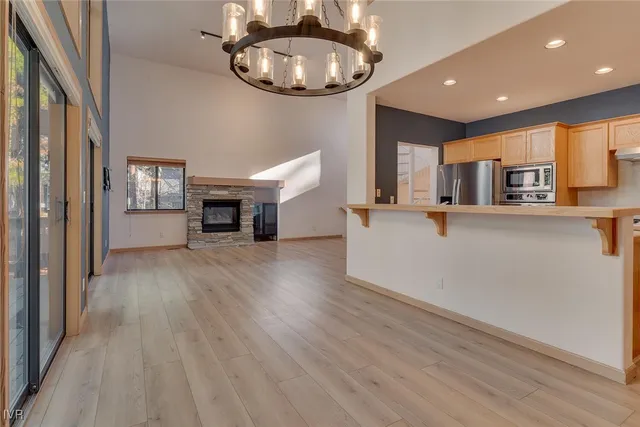 a view of a kitchen with furniture and a fireplace