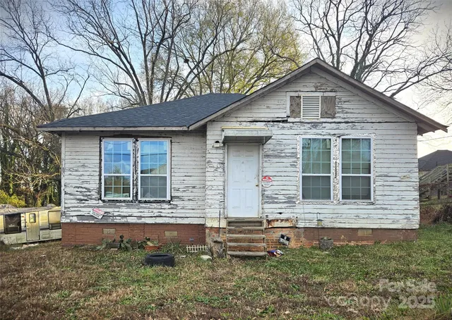 a front view of a house with yard