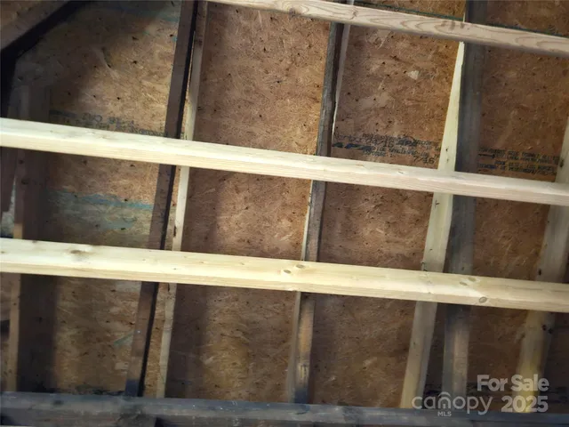 a view of a living room with wooden floor