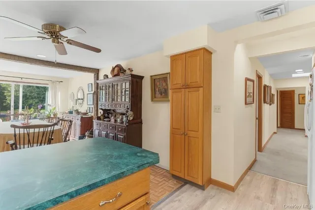 a bedroom with a bed dresser and a window