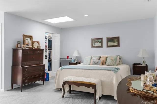 a view of a patio with table and chairs under an umbrella with wooden floor