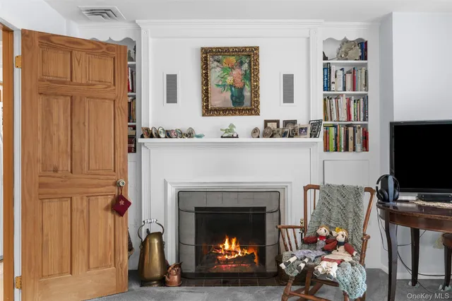 a view of a swimming pool with a patio and a yard
