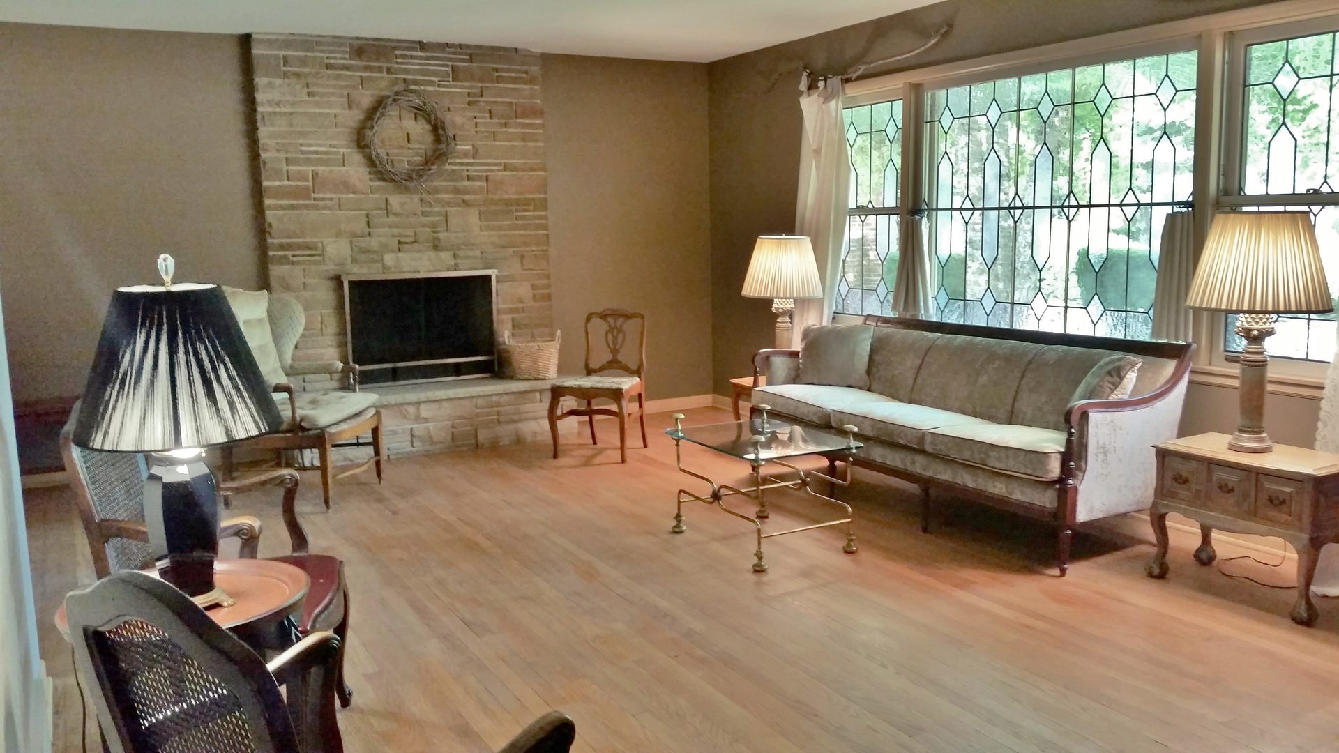 812 North Merrill Street Park Ridge, IL 60068 - Photo 11 of 30 a living room with furniture a fireplace and a floor to ceiling window