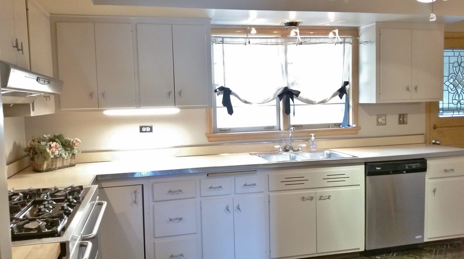 812 North Merrill Street Park Ridge, IL 60068 - Photo 16 of 30 a kitchen with white cabinets and a window
