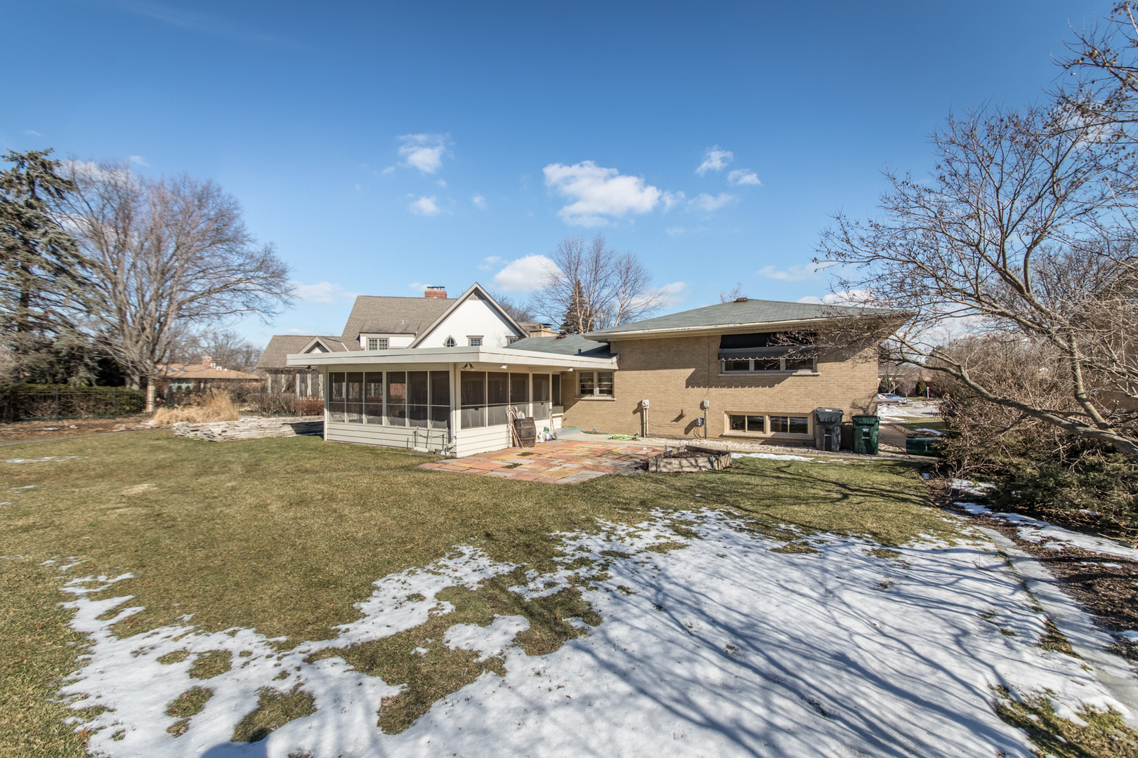 812 North Merrill Street Park Ridge, IL 60068 - Photo 4 of 30 a view of a big house with a big yard and large trees