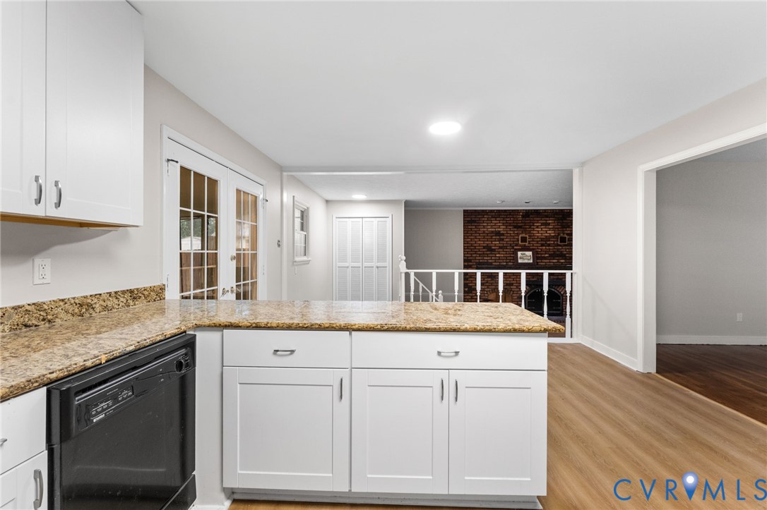 3151 Mountclair Road Chester, VA 23831 - Photo 17 of 36 Kitchen with white shaker cabinetry, speckled coun