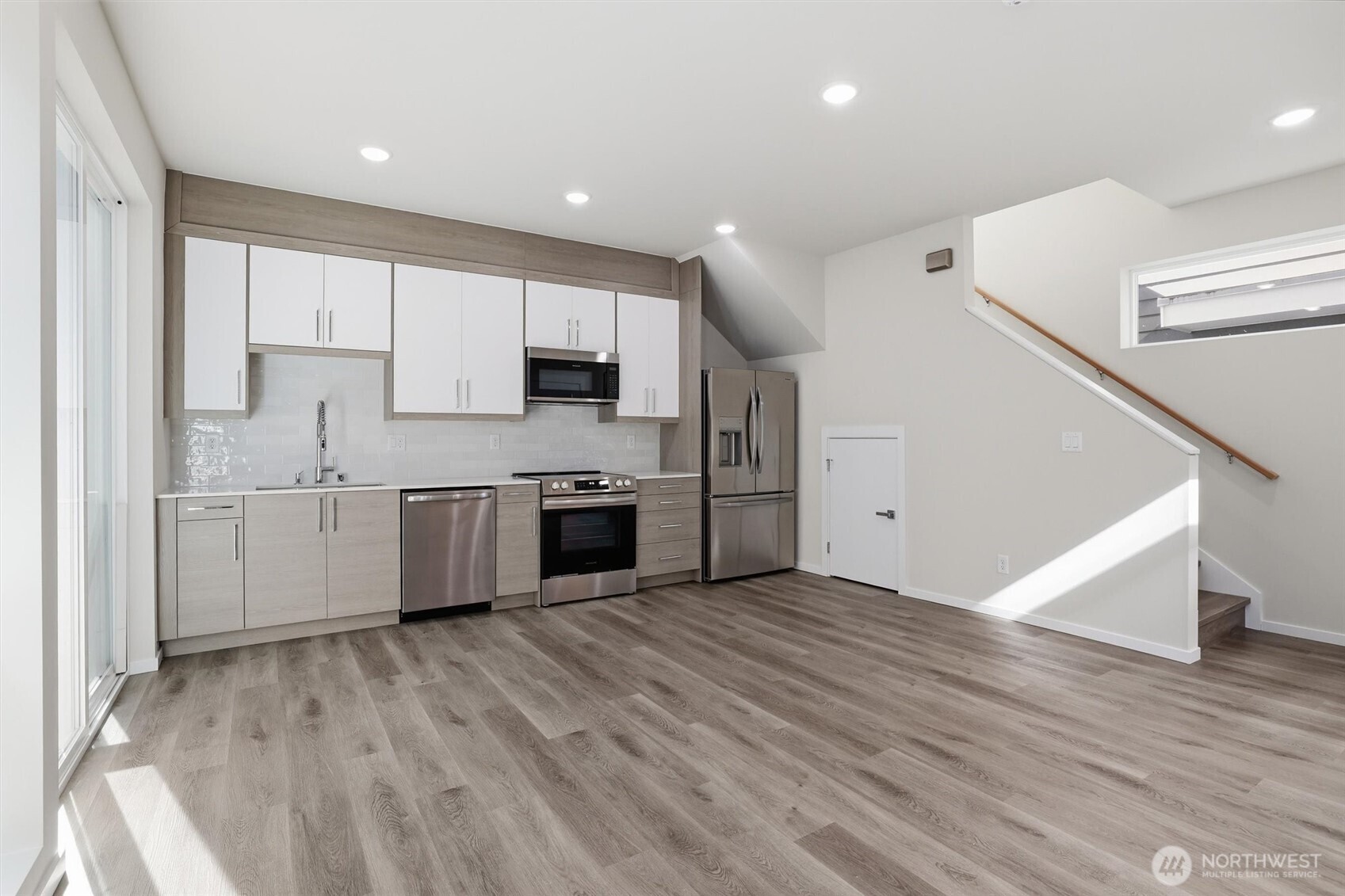 1816 24th Avenue South Seattle, WA 98144 - Photo 6 of 20 a kitchen with stainless steel appliances a sink and a refrigerator