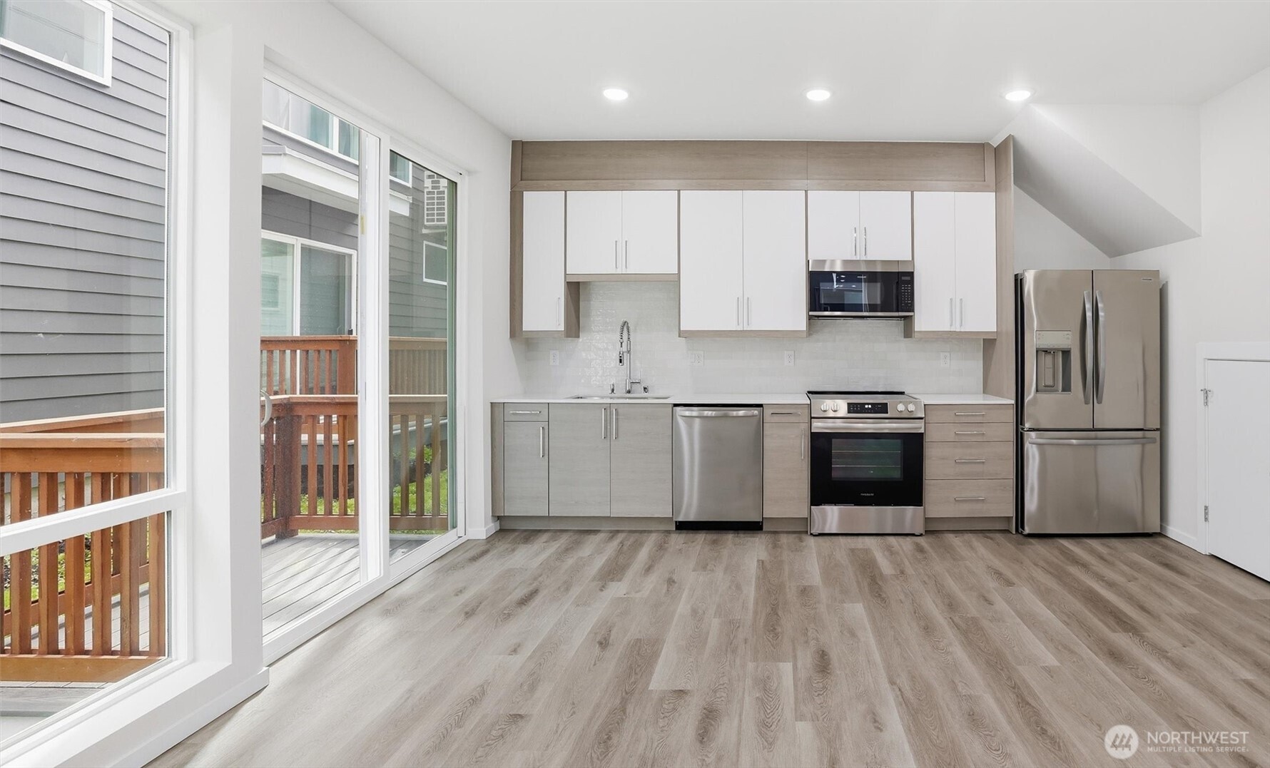 1816 24th Avenue South Seattle, WA 98144 - Photo 7 of 20 a kitchen with stainless steel appliances a stove a sink a refrigerator and a microwave