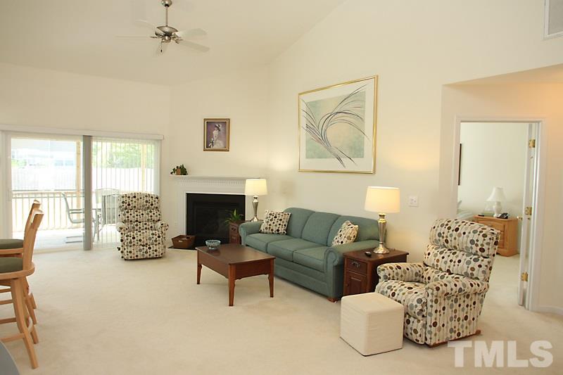 133 Mickleson Ridge Drive Raleigh, NC 27603 - Photo 2 of 18 a living room with furniture fireplace and a large window